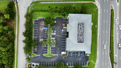 Top-down aerial of an office building, parking lot, and roads, the view used for drone mapping