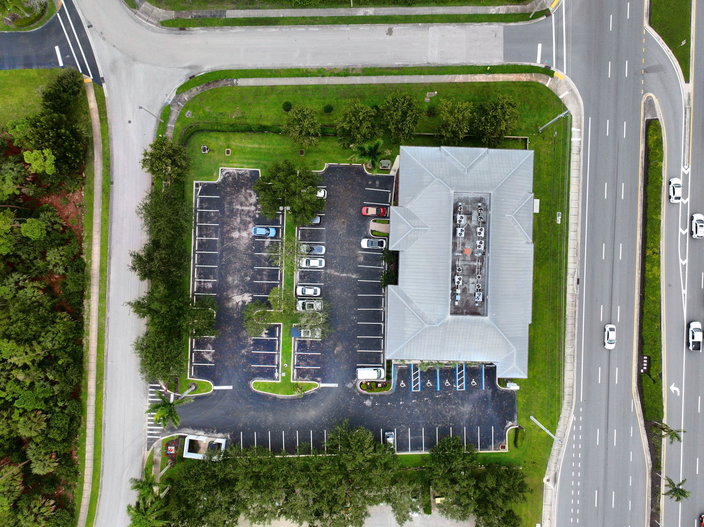 Top-down aerial of an office building, parking lot, and roads, the view used for drone mapping