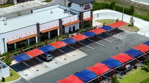 Aerial of a new retail center with covered parking in Orangetree, Collier County