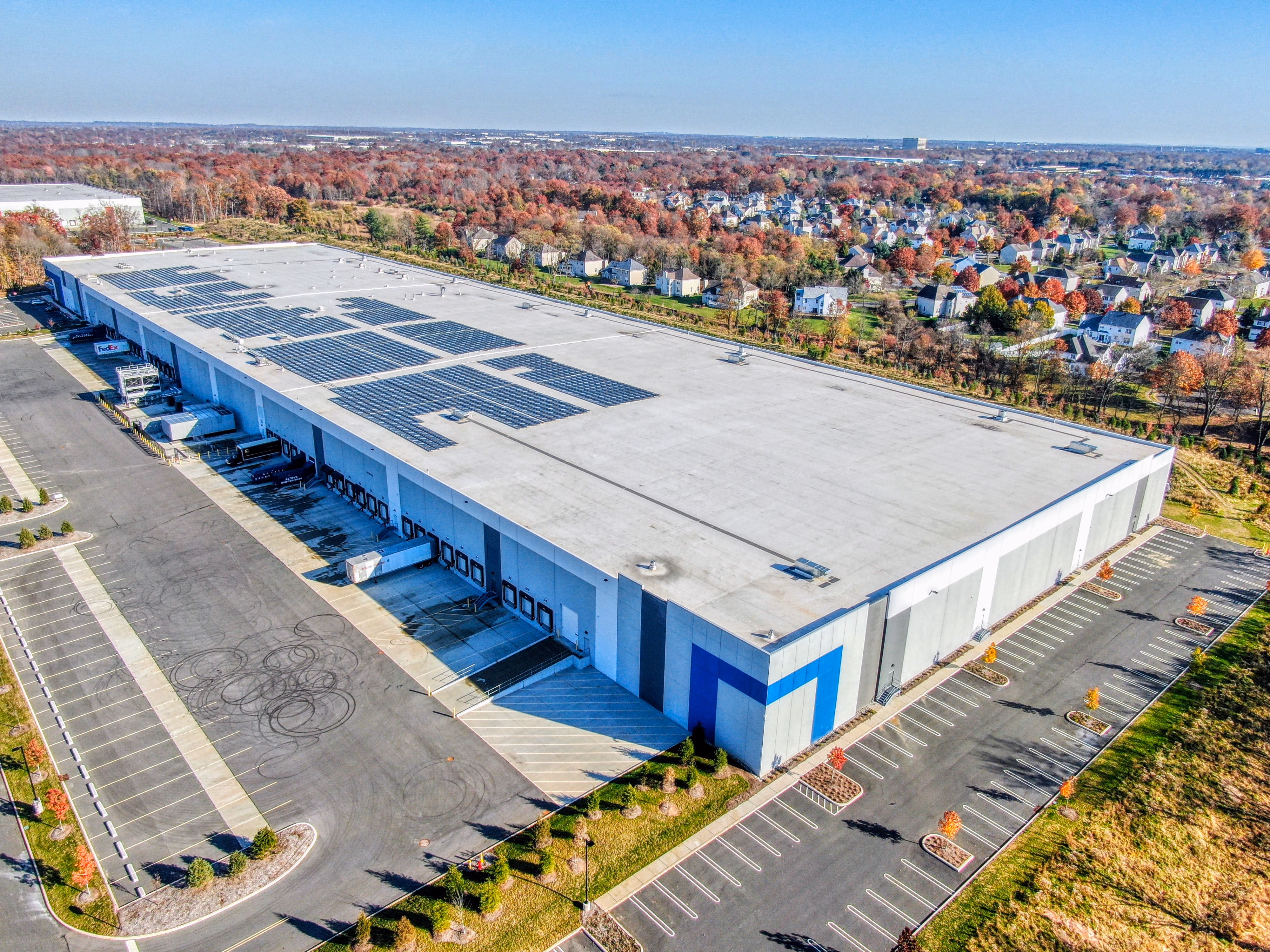 Aerial approach shot of a Florida commercial building, used to illustrate cinematic FPV footage