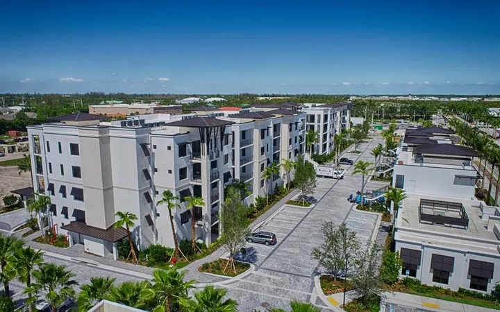 Aerial of Naples Bay Resort marina and condo towers on the water