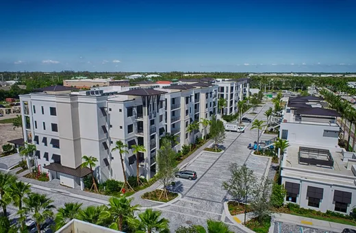 Aerial view of a multi-story commercial building, used in the Highrise Viewer callout