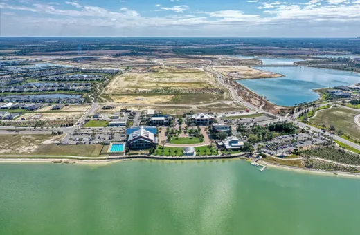 A full Florida master-planned community from above, the kind of dated common-area aerial a board opens in the Community Viewer