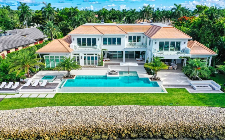 Aerial of a Florida estate lawn and mature grounds used to show what one landscaping flight captures