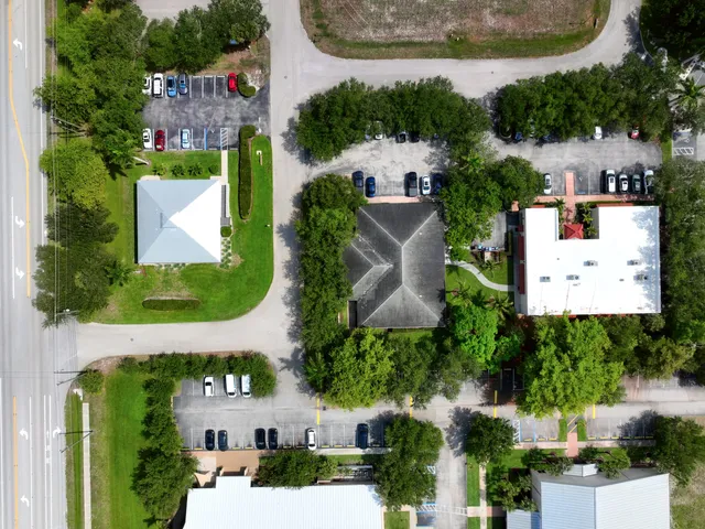 Top-down aerial of a Bonita Springs commercial block, the straight-down view used for mapping