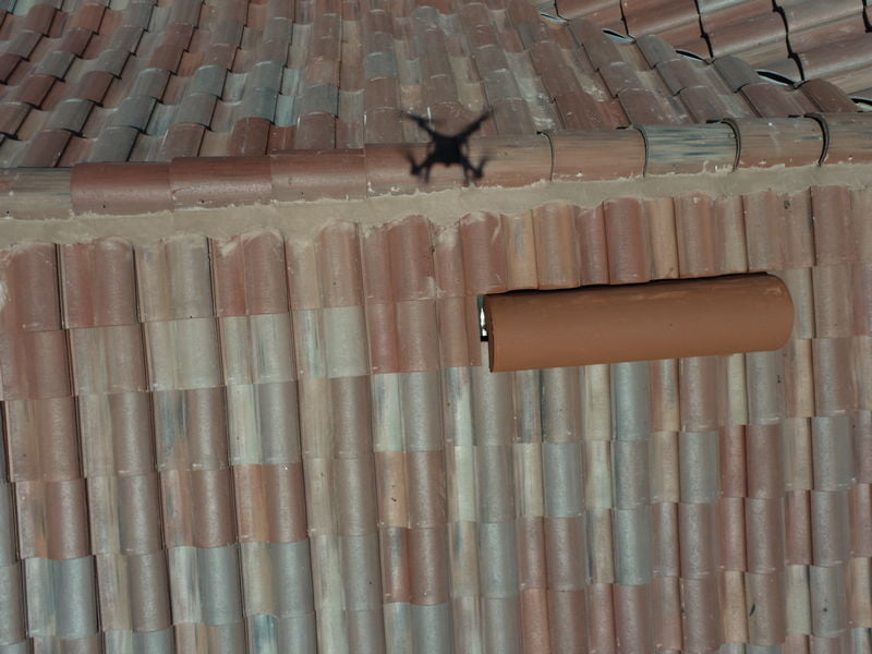 drone flies over roofing for inspection