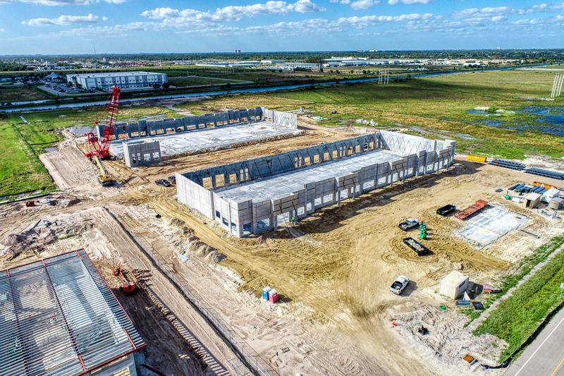 Aerial drone photography of a construction site in progress building a commercial office and warehouse in Fort Myers, Florida