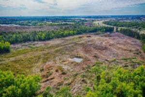 Aerial view of land clearing site, useful in reporting tools for landscaping contractors to track project progress.